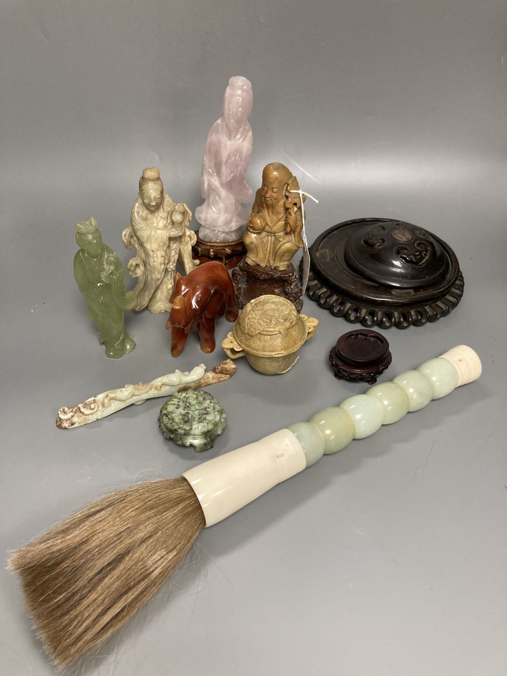 A group of Chinese soapstone, hardstone carvings and wood stands, 19th/20th century